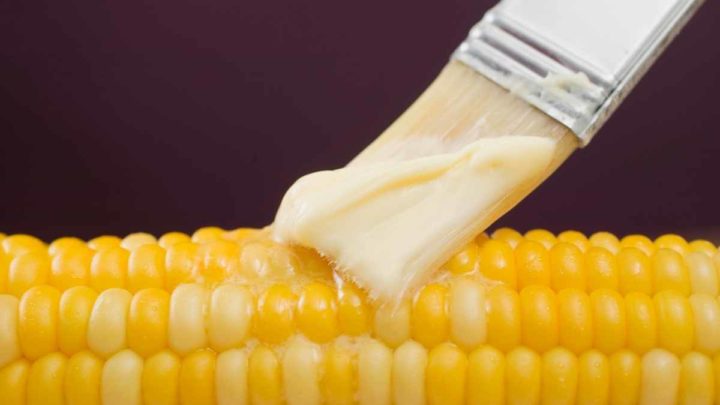 Brush butter on corn