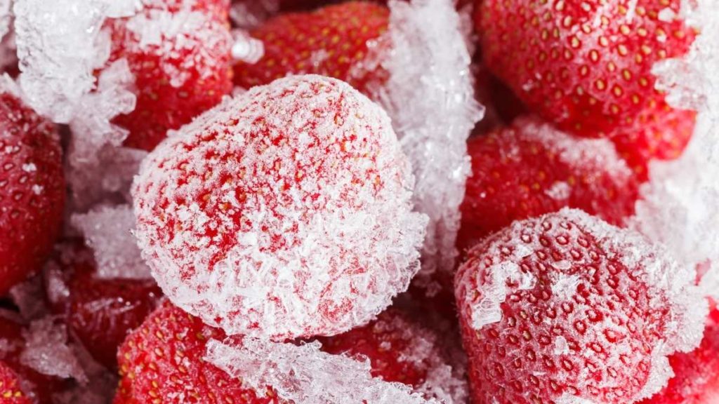 Should strawberries be washed before freezing them?