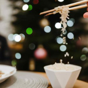 Eating Rice At Christmas Time With Chopsticks